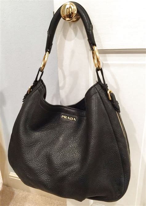 black prada bag with gold hardware